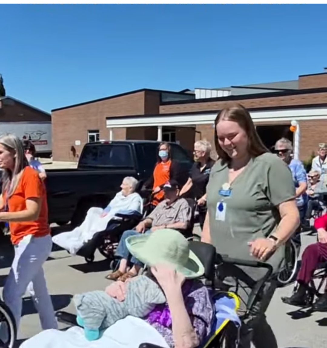 Residents and staff taking part in the Alzheimer's Awareness Walk outside West Perth Village